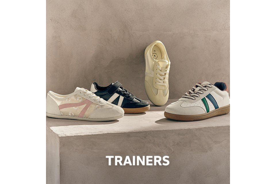 Assorted women’s retro trainers in neutral, black and pastel tones styled as casual everyday footwear.