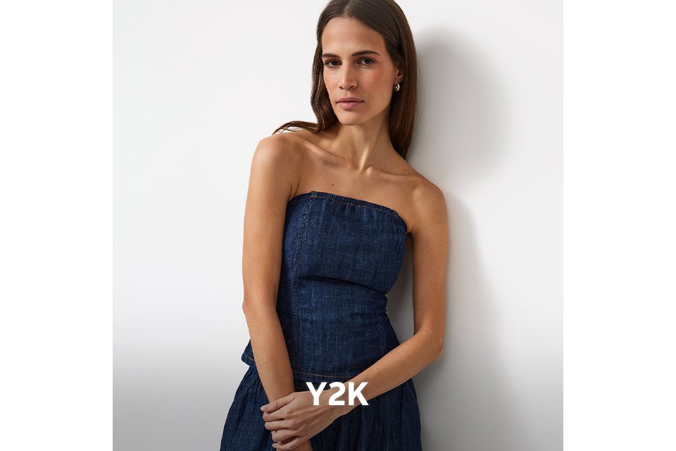 Woman wearing a denim strapless top.