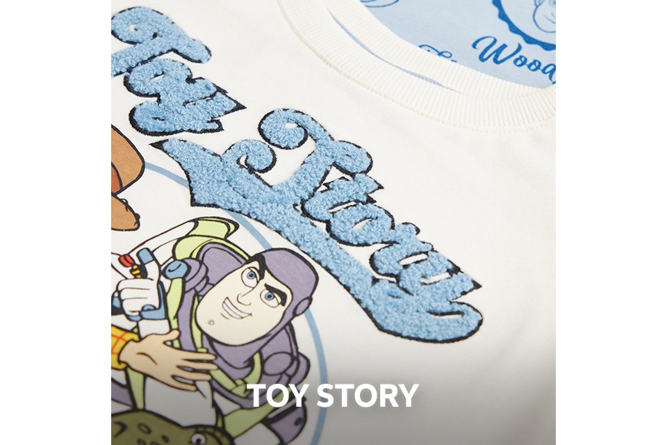 Close up shot of a piece of kids clothing showing a toy story motif.