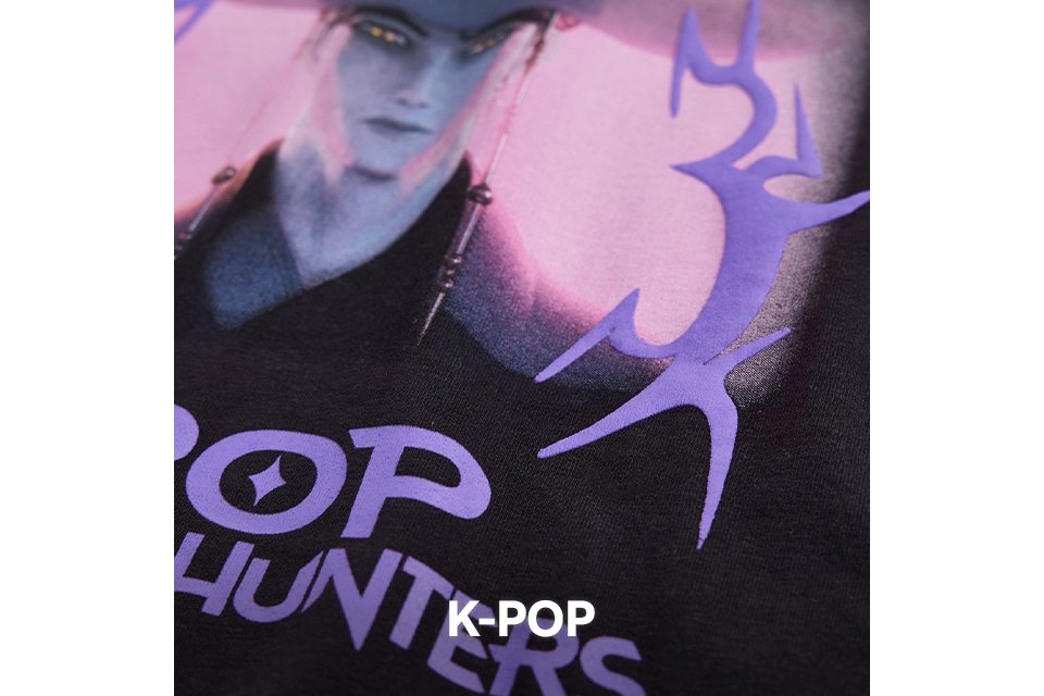 Close up shot of a piece of kids clothing showing a k-pop logo.
