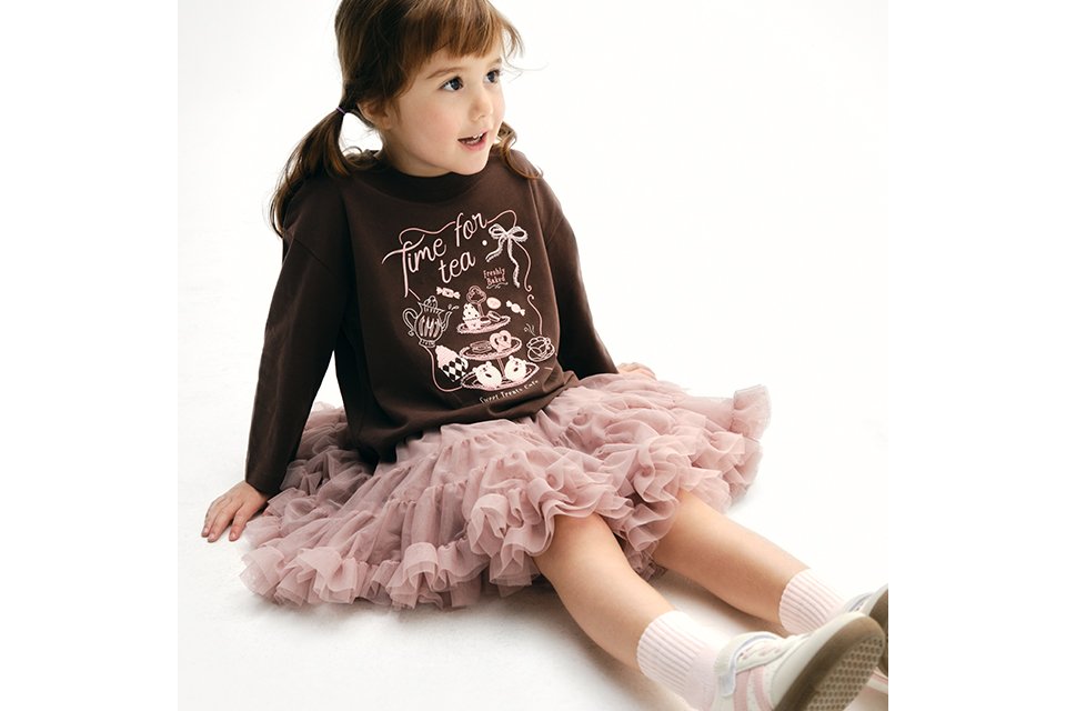 Kids' tea party graphic sweatshirt dress featuring a chocolate brown top with a layered blush pink ruffle tutu skirt.