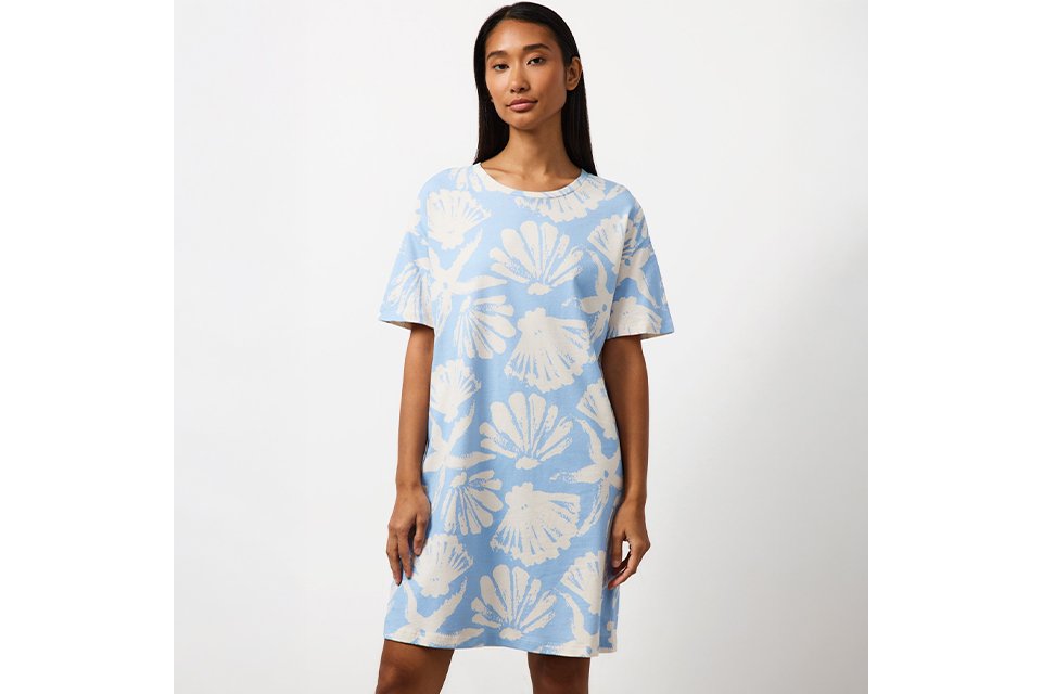 Light blue T-shirt nightdress featuring an all-over white seashell print and a relaxed short-sleeve silhouette.