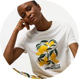 White lemon print T-shirt paired with matching lemon pattern cropped trousers in a coordinated summer loungewear set. 