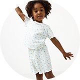 Kids' white short-sleeve top and matching shorts set featuring a delicate blue floral print and soft ribbed texture.