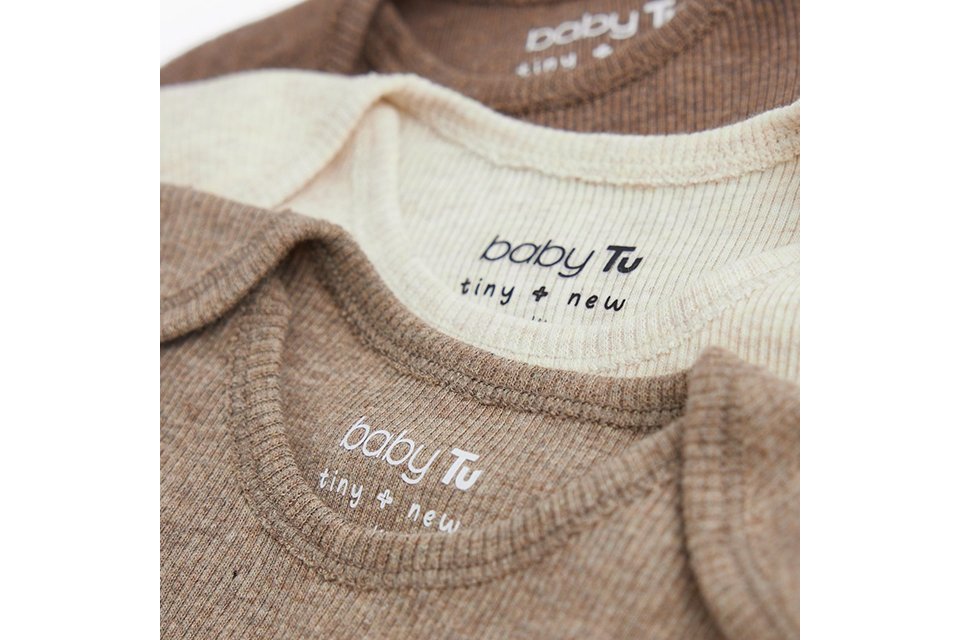 Set of ribbed baby bodysuits in neutral cream and beige tones, featuring envelope necklines and soft stretch fabric for comfortable everyday infant wear.