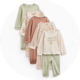 Five-piece baby pyjama set in soft pastel tones featuring long-sleeve tops and matching bottoms with cosy café-inspired prints, stripes, and embroidered slogan details, displayed against a white background.