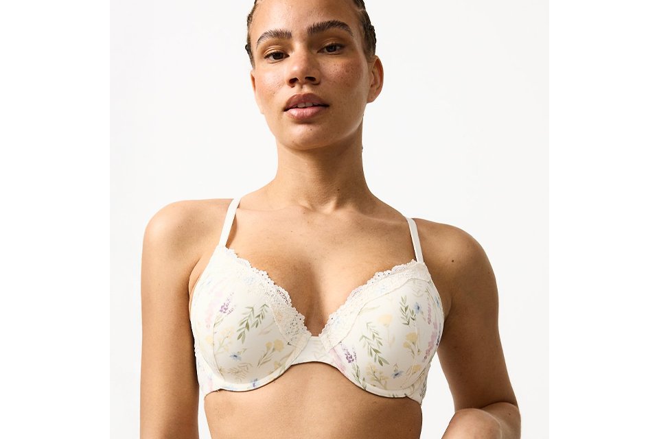 Women's white floral print T-shirt bra with multicoloured floral pattern, padded cups, underwired support and adjustable shoulder straps.