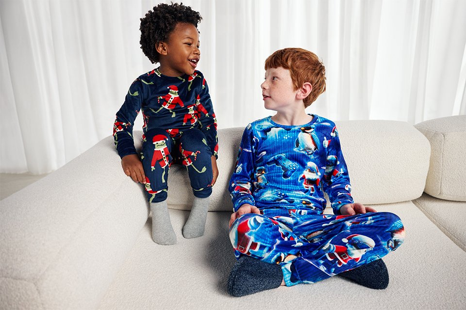 Kids wearing novely pyjamas.