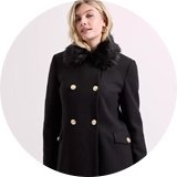 Dark brown dolly coat with a flared hem and large buttons.