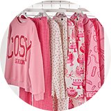 Wearing wearing pink cosy pyjamas.