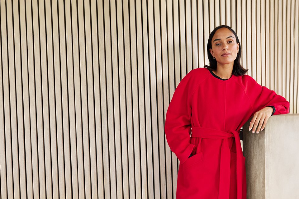 Women wearing bright red coat.