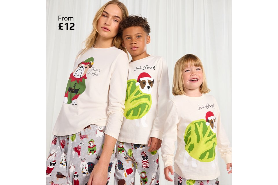 Family wearing matching christmas pyjamas.