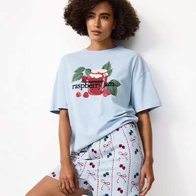 Women's short pyjama set featuring printed T-shirt and shorts, lightweight sleepwear ideal for warmer nights.
