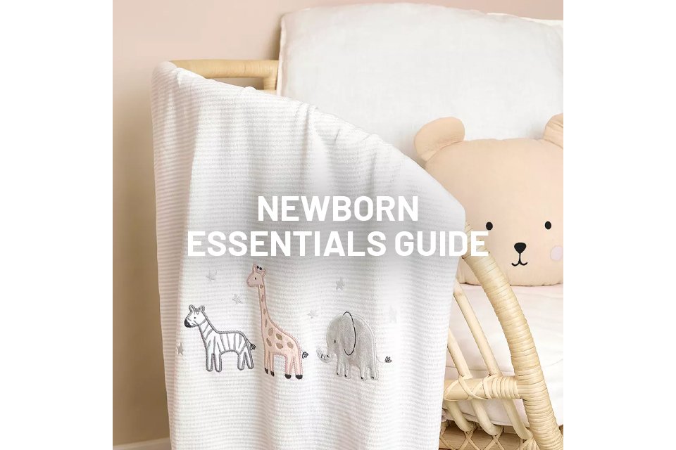 A blanket with animals on draped over a chair.