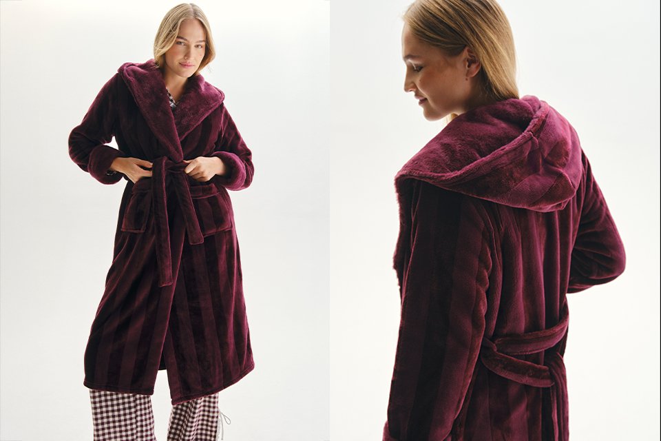Burgundy hooded plush robe coat with a tie-waist belt and soft textured fabric, viewed from the back and side, showcasing cozy loungewear styling.