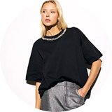 Dark wash jeans styled with sequin top – casual festive outfit idea.