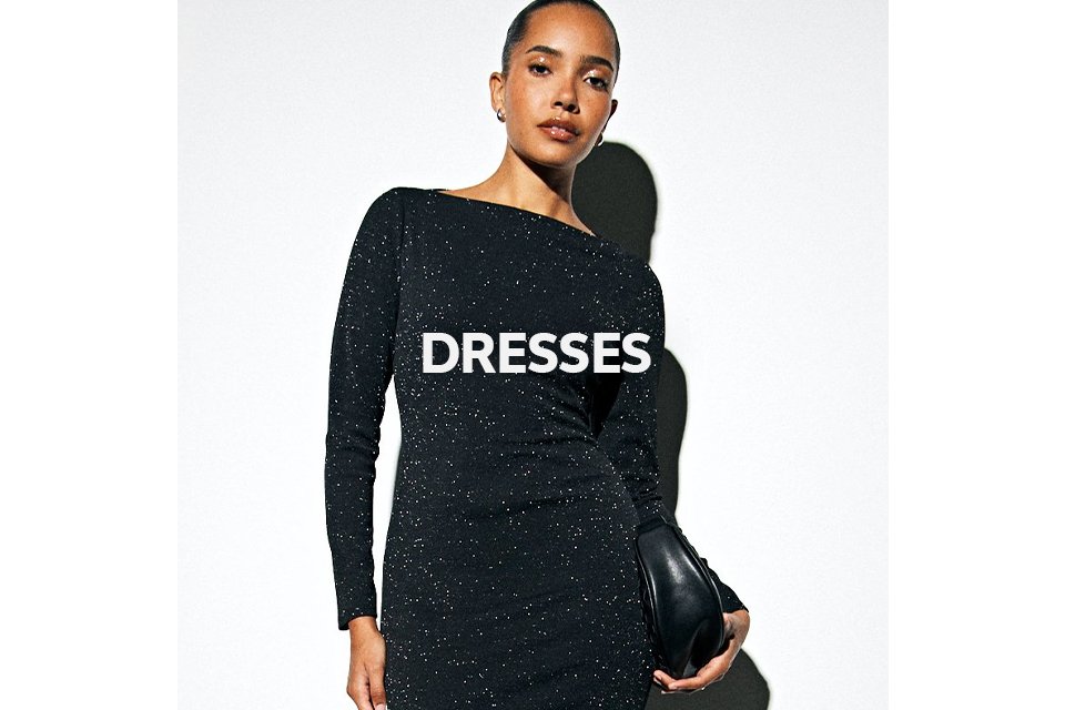 Woman wearing black long sleev shimmer midaxi dress.