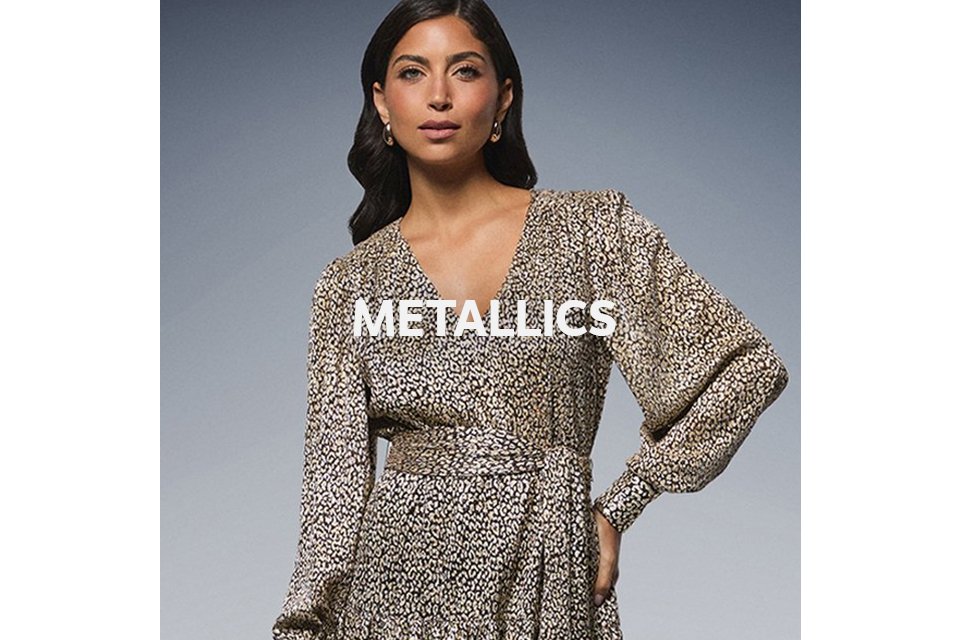 Woman wearing animal print metallic tie waist midi dress.