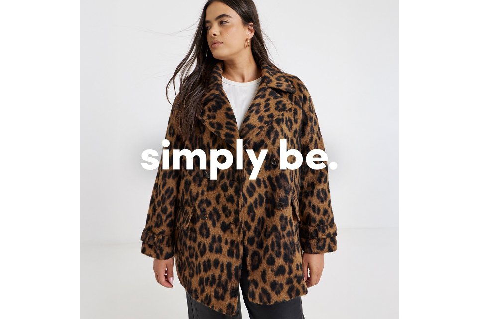 A woman wearing pink and burgundy sequin cardigan.