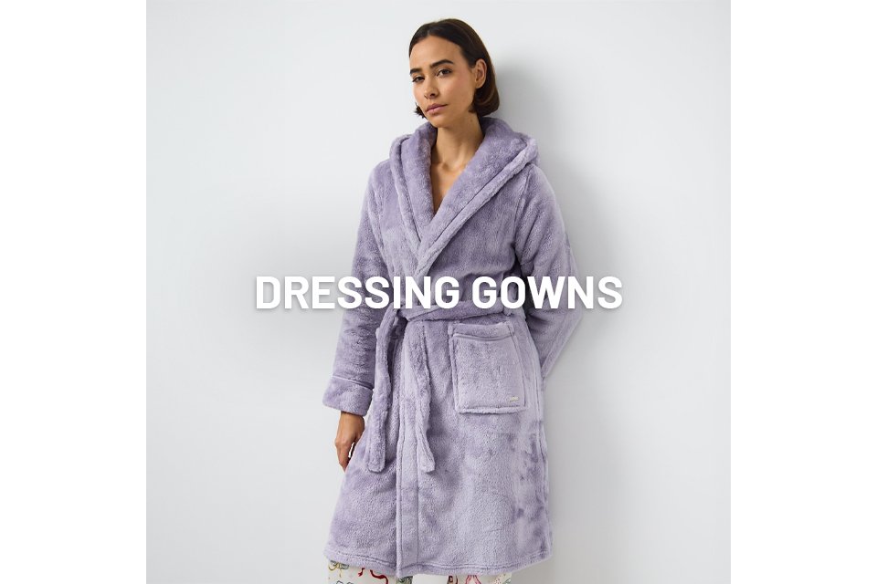 A woman wearing a lilac dressing gown.