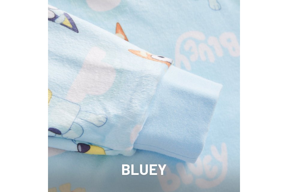 Light blue fabric with printed characters from the animated series Bluey, showing playful scenes and text.