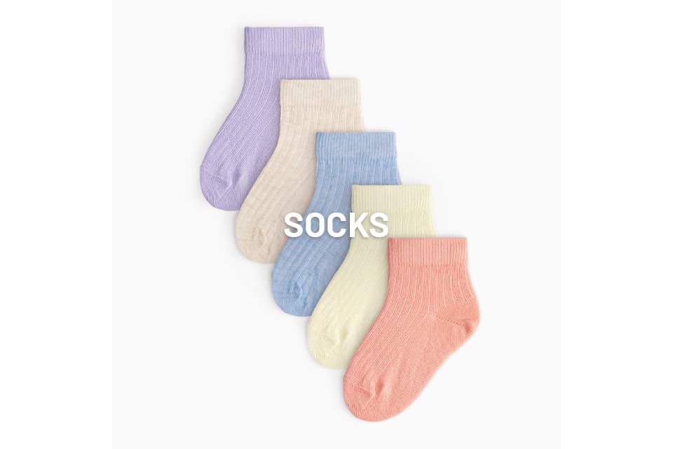 An image of 5 socks laying flat, in different pastel colours.