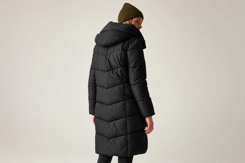 Two long winter coats displayed: a camel trench coat with a tie belt and a textured beige relaxed-fit coat worn over a white top and blue jeans.