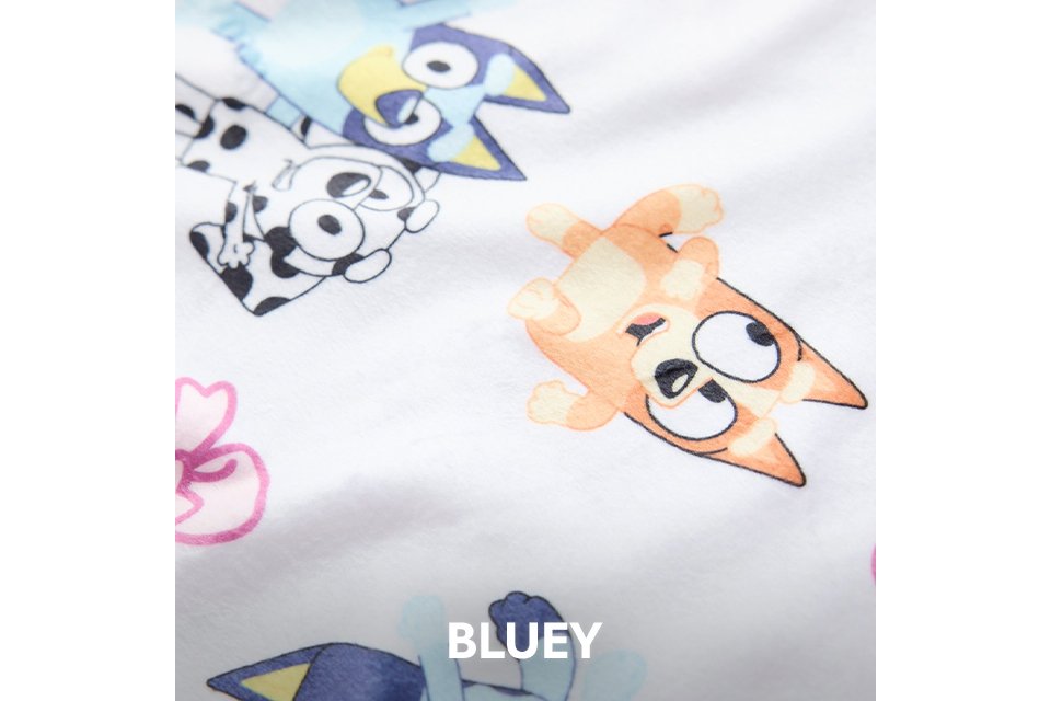 White nightwear fabric with Bluey character prints in blue and orange tones.