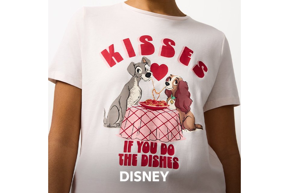 White nightwear top featuring Lady and the Tramp graphic with text "Kisses if you do the dishes."