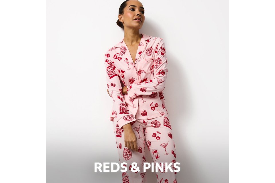 Pink pyjama set with red strawberry print. 