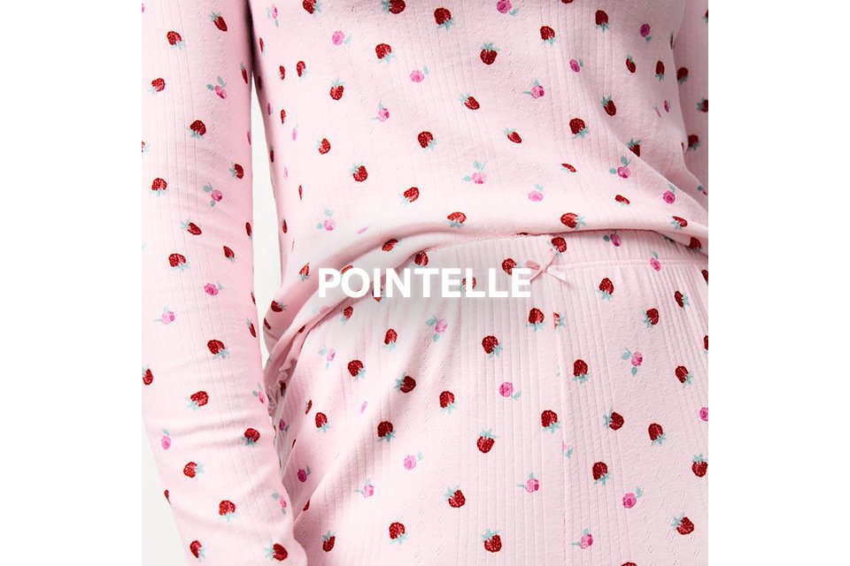 Light pink pointelle nightwear with small red strawberry print.