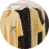 Stack of folded nightwear in yellow and black patterns. 