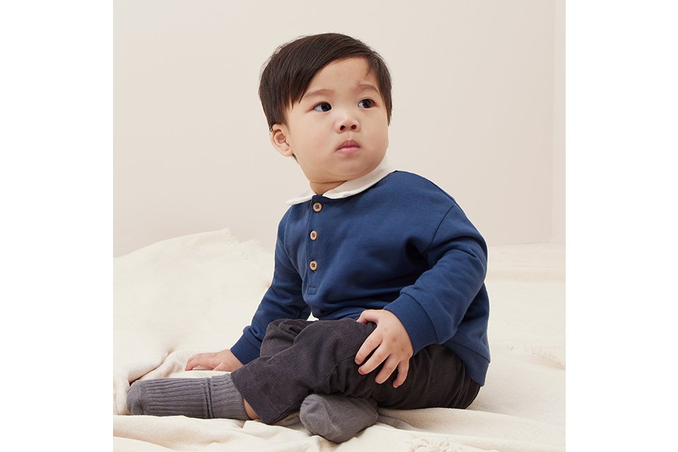 Essential baby boy clothing set with short-sleeve top and comfy bottoms in soft beige fabric.
