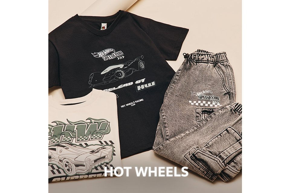 Flat lay of a black Hot Wheels T-shirt with car graphics, paired with grey joggers and additional printed tops.