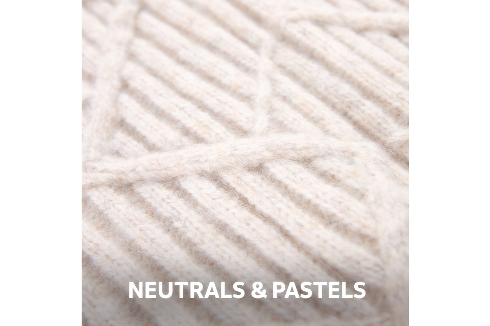 Close-up of cream textured yarn in a soft, neutral tone.
