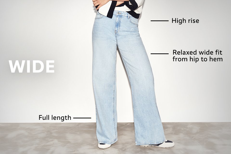 High-rise wide-leg jeans in light blue denim with relaxed fit from hip to hem and full-length design, styled with trainers.