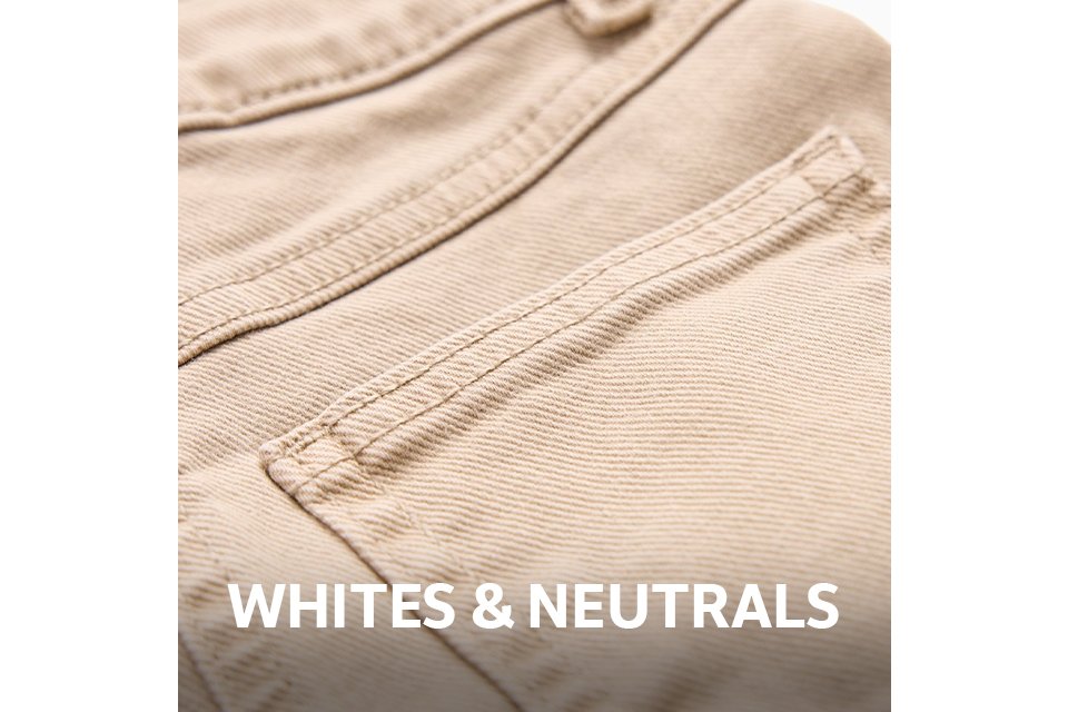 Close-up of the back pocket and waistband of beige denim jeans, featuring tonal stitching and a classic five-pocket design.
