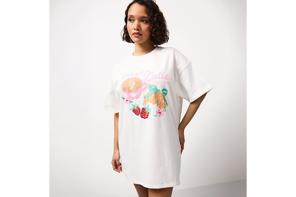 White top with pancake stack illustration and slogan on the back.