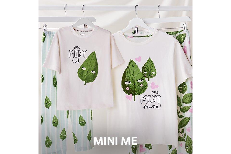 Matching striped pyjama sets with red piping detail worn by an adult and child.