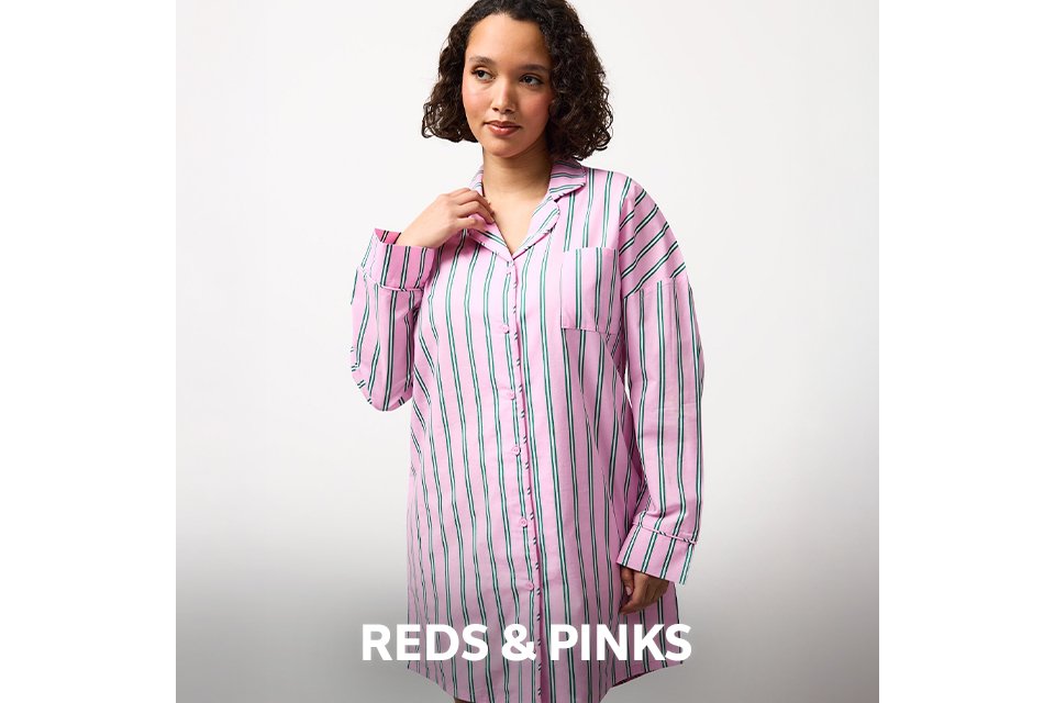 Pink pyjama set with red strawberry print. 