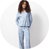 Full-length pyjama set with pink check and red hearts.
