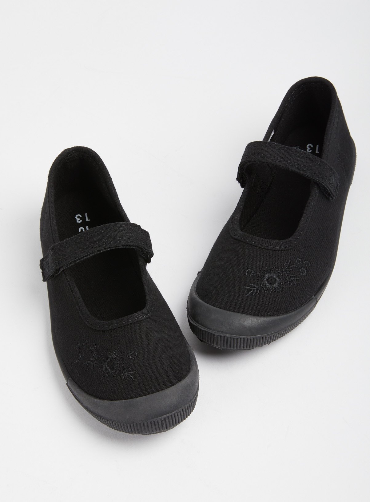 girls black plimsoles