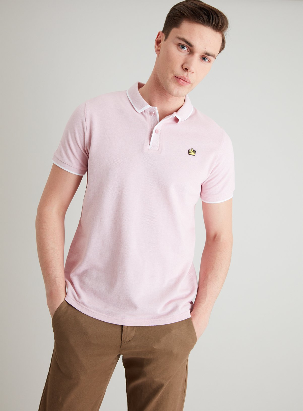 pink polo shirt with khaki pants