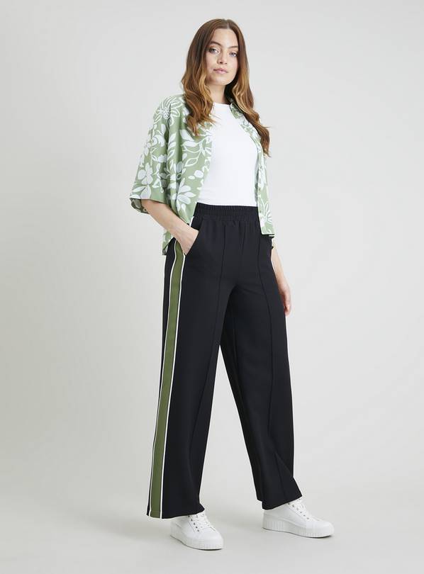 Black pants with shop green side stripe