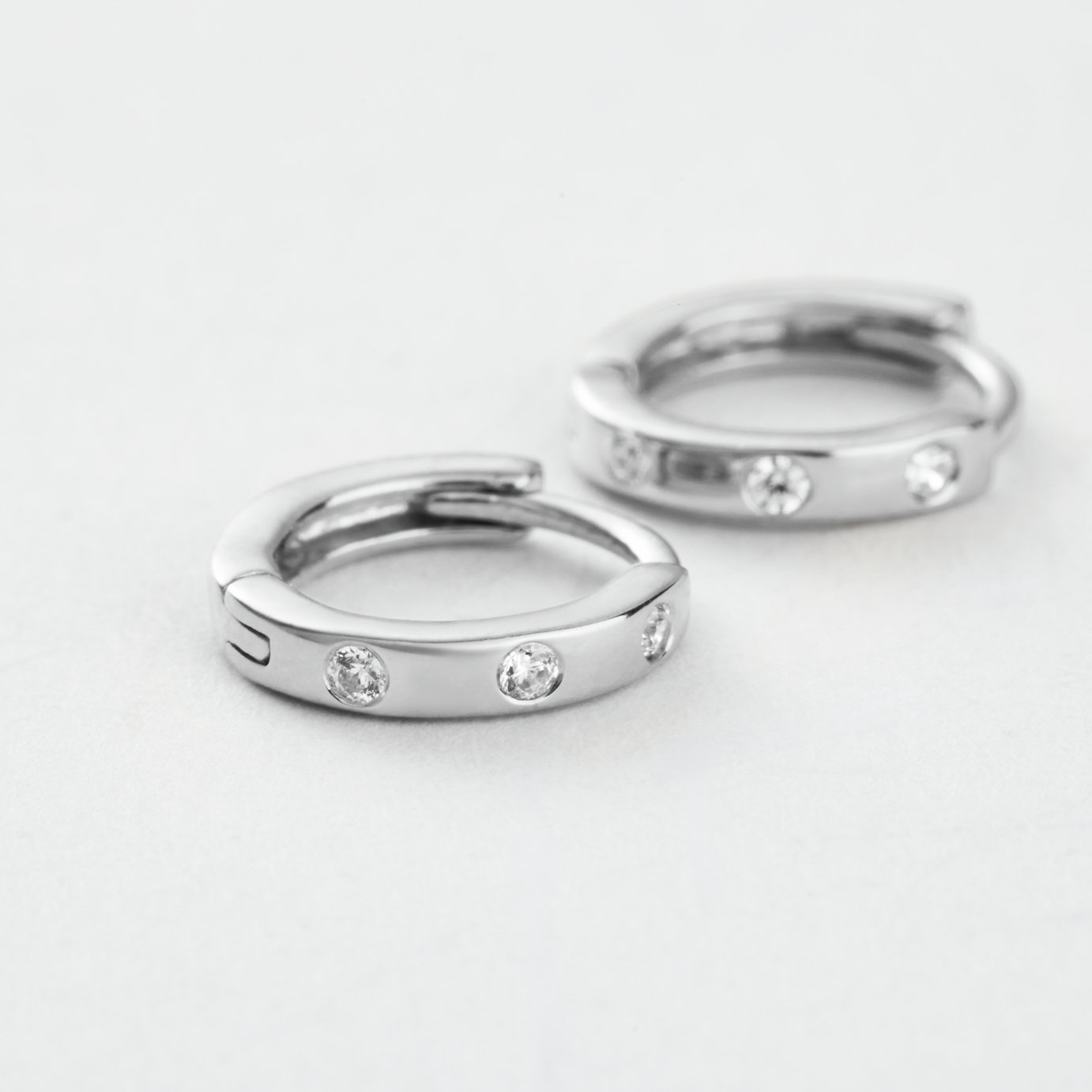 Revere Sterling Silver Cubic Zirconia Mini Huggies Earrings