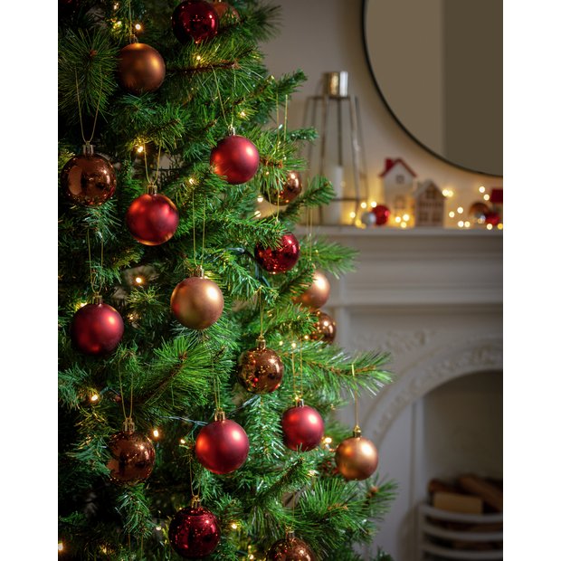 christmas trees decorated with red and gold