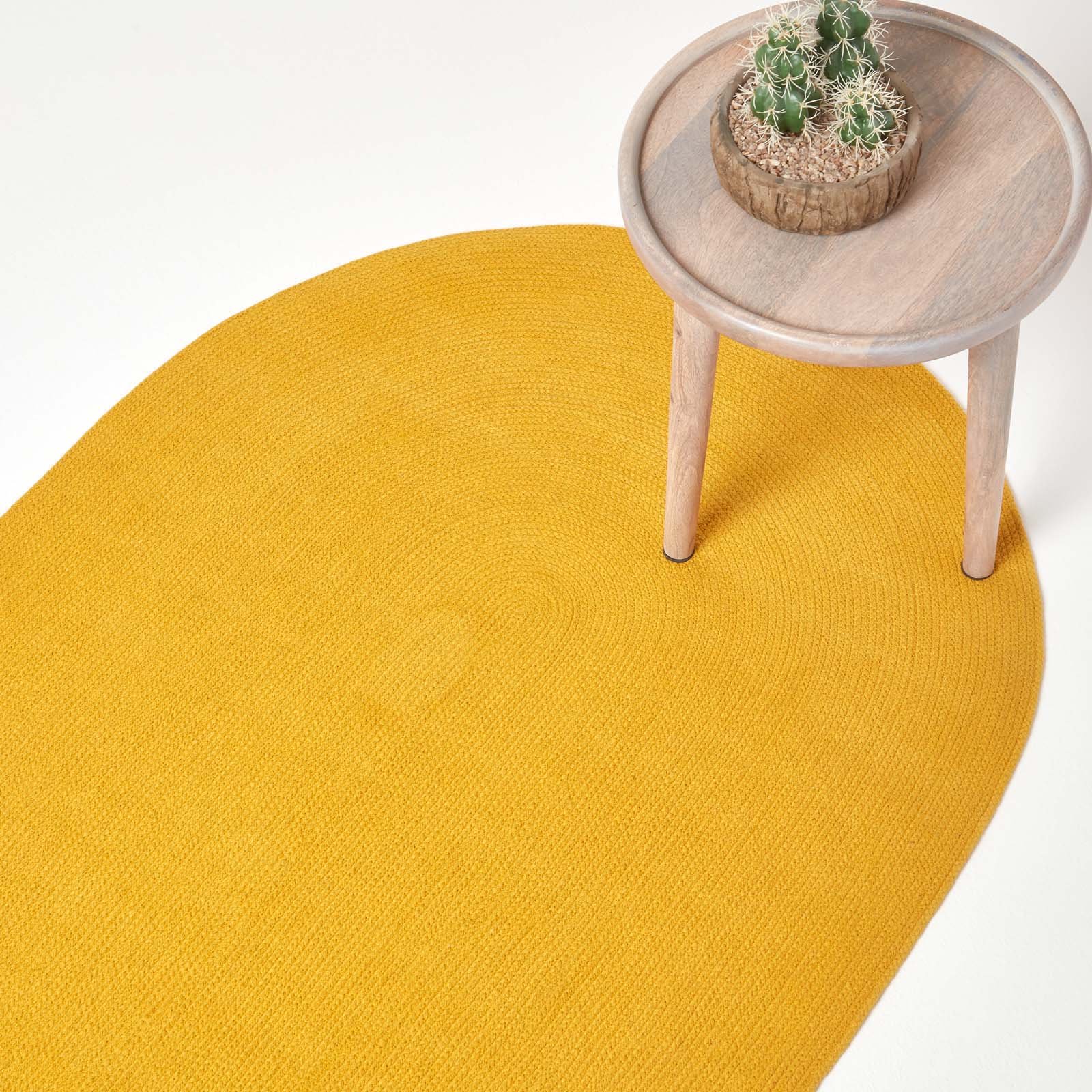 Homescapes Mustard Yellow Handmade Braided Oval Rug - 60 x 90cm