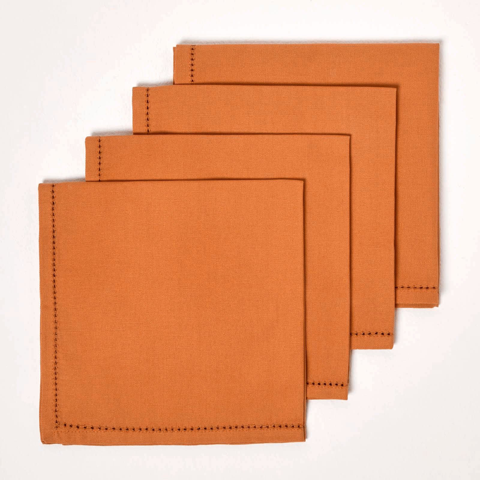 Homescapes Pack of 4 Plain Cotton Napkins - Burnt Orange